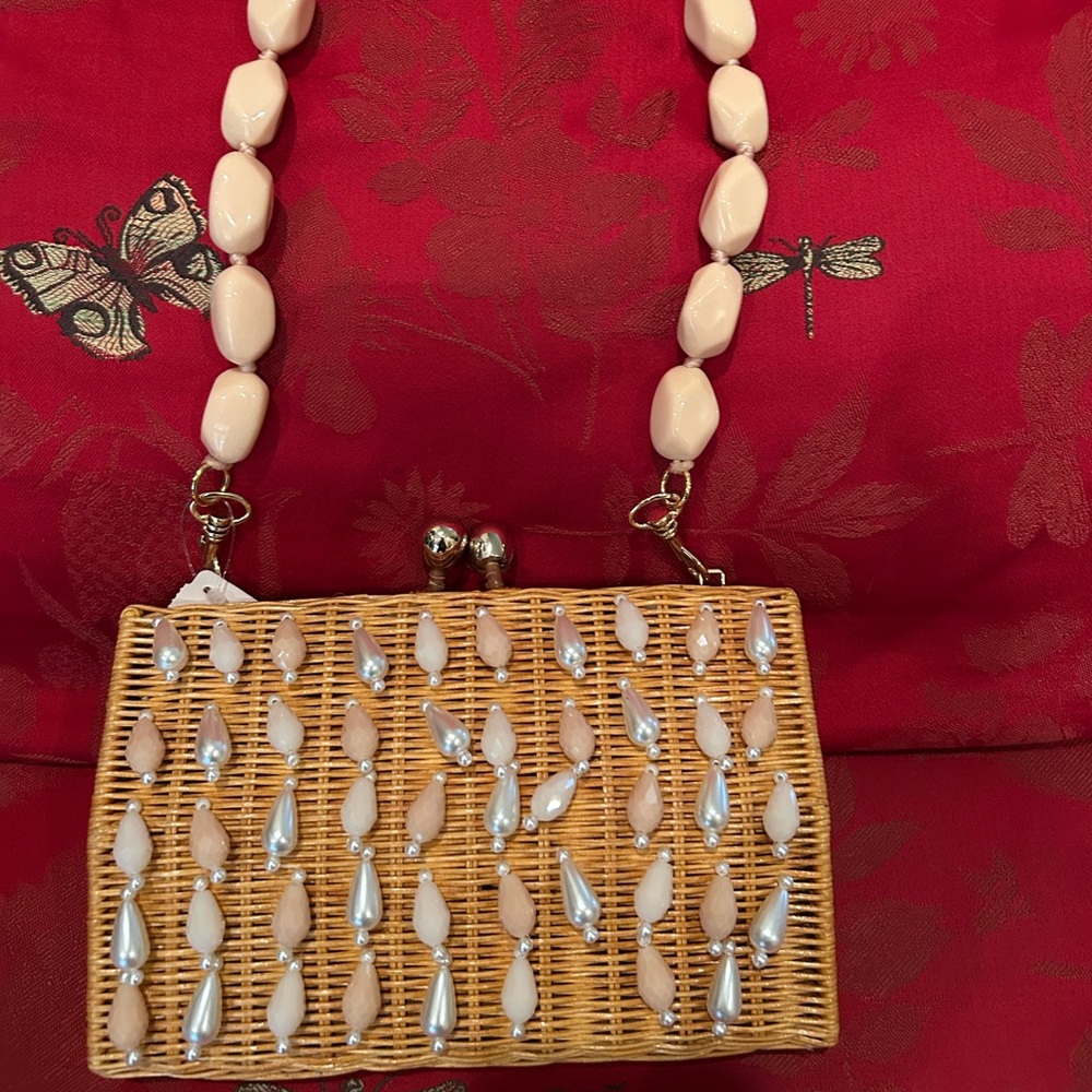 Corina Rain Mother-of-Pearl Straw Crossbody Clutch Bag.